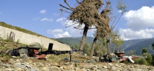 Army jawans in action at the site of encounter in Lolab area in Kupwara district on Tuesday. -Excelsior/Aabid Nabi