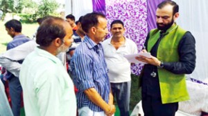 HoD Cardiology Dr Sushil Sharma examining patients in a camp on Sunday.