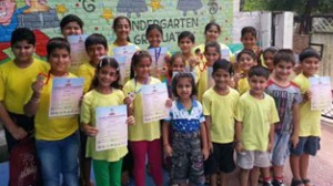 Students along with certificates and medals posing for a photograph during ‘Level Completion’ ceremony organized by UCMAS Abacus at Jammu.