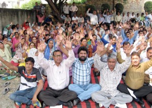 Estates employees raising slogans in support of rheir demands on Monday.