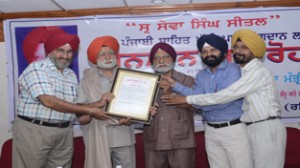 Dignitaries presenting citation to Sewa Singh Sital at Jammu on Wednesday. 