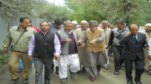 Prof Saif-ud-Din Soz visiting flood hit areas in Sangrama.