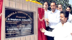 Minister for Housing, Raman Bhalla and Minister for ULBs Nawang Rigzin Jora inaugurating 19th Bakula Rinpoche road on Monday.