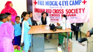  Doctor examining the patients during Medical Camp organized  by Red Cross on Friday.
