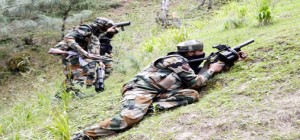 Army jawans in action during encounter at Wuderbala in Handwara on Monday.  	-Excelsior/Aabid Nabi