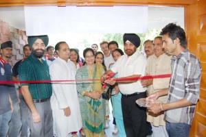 A dignitary inaugurating 3-day Khadi Gram Udyog Mela at Government SPMR College of Commerce in Jammu.