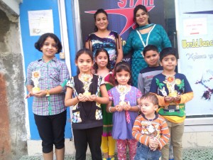Winners of dance competition posing for a group photograph at Lower Roop Nagar, Jammu.