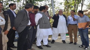Minister for Roads and Buildings Abdul Majid Wani taking stock of post-flood situation during his tour on Sunday.