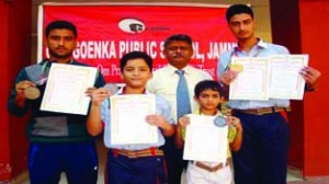 Students of GD Goenka Public School displaying certificates after excelling in International Karate Championship. 