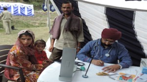 A CRPF Doctor examining a patient at Panjar Udhampur on Tuesday.