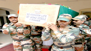 Army Jawan carrying body of martyr Akshay Godbole for wreath laying ceremony at Tiger Division on Sunday.