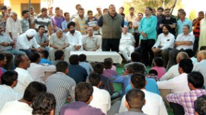 Provincial President NC, Devender Singh Rana interacting with the firing sufferers at Arnia on  Tuesday. 
