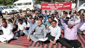 Casual and need base workers staging protest dharna at Press Club in Jammu on Wednesday. -Excelsior/Rakesh