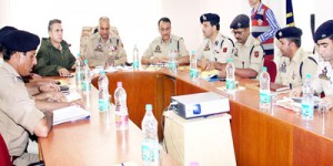 DGP K Rajendra chairing a meeting at Baramulla on Monday.