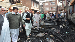 Speaker Legislative Assembly, Mubarak Gul taking stock of damages due to fire incident at Srinagar on Sunday.