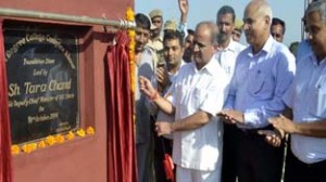 Deputy Chief Minister, Tara Chand laying foundation stone of Degree College Khour on Friday.