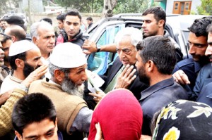 PDP patron Mufti Mohammad Sayeed meeting people at a flood hit area of Pulwama.