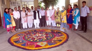 A large rangoli decorated with diyas on Diwali.