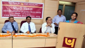 A participant reciting a poem during a competition organized by PNB, Circle Office, Jammu.