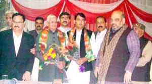 BJP president Amit Shah and other party leaders with Govind Ram Sharma who joined the party  at Jammu on Wednesday.
