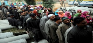 Voters stand in a long queue as they wait to cast their vote at a polling station in Ganderbal on Tuesday. -Excelsior/Amin War