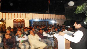Former Minister G S Charak addressing election meeting at Bishnah on Sunday.
