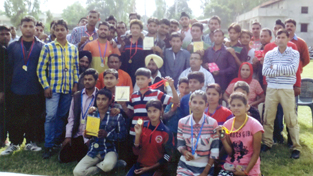 The winners of Athletic Meet posing along with dignitaries and officials at Bana Singh Stadium in RS Pura.