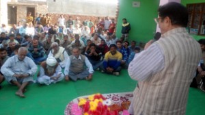 Former minister G S Charak addressing public rally in Bishnah on Friday.