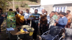 Arya Pratinidhi Sabha members distributing relief among flood hit people in Udhampur.