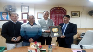 PNB Circle Head, Jammu, MI Mir, Chief Manager, Sunil Khosa, Senior Manager, Anil Bali and Senior Manager, Official Language, Jagdish Lal, posing with shield.