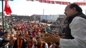 NC leader Surjeet Singh Slathia addressing public meeting at Vijaypur on Sunday.