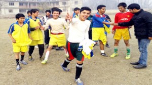 Young footballers celebrating victory during Coca-Cola Inter-School Football Tournament at Srinagar.