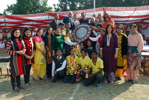 Winners of individual events and overall trophy posing for a photograph at MHAC School, Nagbani in Jammu.