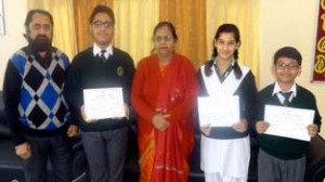 DPS students who win prizes in State Level Art Competition, posing with dignitaries at Jammu.