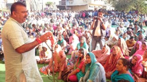 Chander Parkash Ganga addressing a public meeting at Nagwal on Monday.  -Excelsior/Gautam