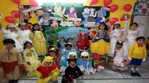 Kids wearing colourful costumes during a Fancy Dress Competition at Kids Campus.