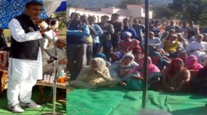 PHE Minister Sham Lal Sharma addressing public rally in Akhnoor on Monday. 