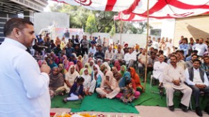 Madan Lal Sharma addressing a public meeting on Friday.