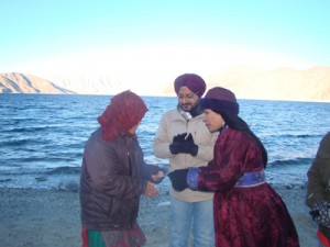 Filmmaker Rajni Basumatary distributing EPIC to a voter near Pangong lake in the presence of DC Leh Simrandeep Singh.