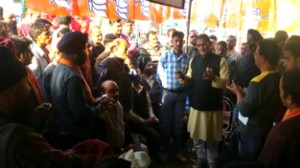 Kavinder Gupta addressing a public meeting in Gandhi Nagar area on Friday.