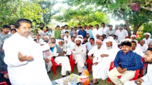 Minister for Housing Raman Bhalla addressing public meeting on Wednesday.
