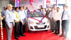 Officials of Jamkash Vehicleades unveiling new generation Alto K10 at Jammu on Wednesday.