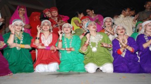 The artists performing cultural show organized by Jammu and Kashmir Academy of Art, Culture and Languages on Friday.