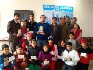 Winners of Chess Tournament posing along with dignitaries and officials.