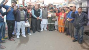 Congress candidate S S Shingari conducting door-to-door campaign on Tuesday.