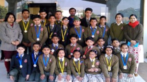 Students of KC Gurukul, who won medals in 2nd State Patanque Championship posing for a group photograph.