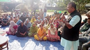 BJP candidate from Vijaypur C P Ganga addressing an election meeting on Tuesday. -Excelsior/Gautam