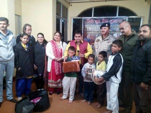Orphans being presented with gifts after musical night at Katra on Sunday. 
