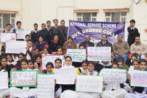 Students displaying slogans during poetry recitation and slogan writing competition at GDC Samba.