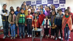 Children posing for a group photograph during Natrang Children Winter Theatre Workshop in Jammu.